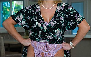 Ryan Keely in pink lingerie and sexy nylons loves posing for camera