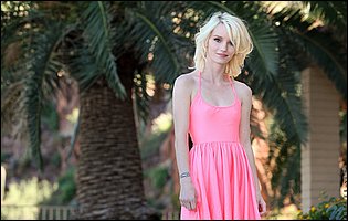 Sammie Daniels in pink dress stripping and posing naked outdoor