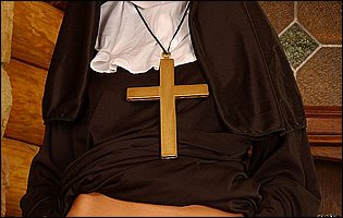 Naughty nun Sandy Fantasy fucking her pussy with cucumber
