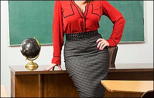 Busty teacher Sara Jay in black pantyhose strips in the classroom