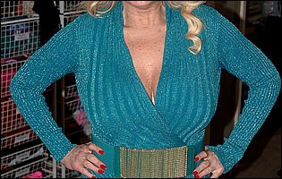 Busty mature blonde Tahnee Taylor loves posing for camera