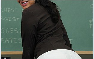 Tara Holiday stripping and posing in the classroom