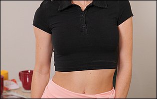 Cute brunette Theodora Day poses in black t-shirt and pink skirt