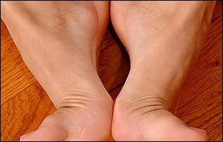 Beautiful young lady Tiffany Rousso enjoys foot fetish sex.
