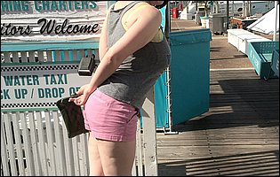 Cute busty brunette Tiggle Bitties poses for camera outdoor