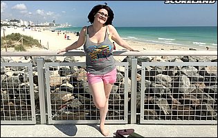 Cute busty brunette Tiggle Bitties poses for camera outdoor