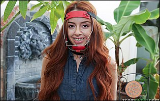 Innocent redhead Vanna Bardot strips and poses outdoor