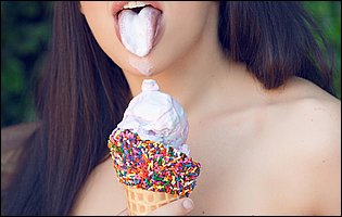 Roller girl Whitney Wright licks ice cream outdoor